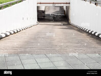 concrete-slope-way-to-the-underground-parking-building-of-the-urban-GYJDA5.jpg