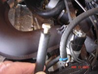 031309 VES  solenoid bolt plugging drain hose a.jpg